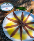 Filetes de anchoa 00 con mantequilla artesana presentados en plato
