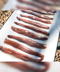 Filetes grandes de anchoa de costera con mantequilla
