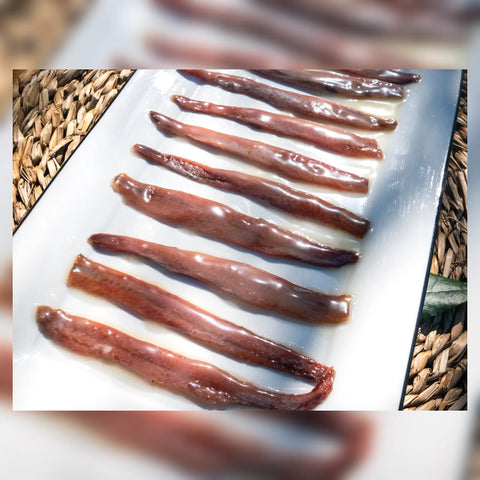 Filetes grandes de anchoa de costera con mantequilla